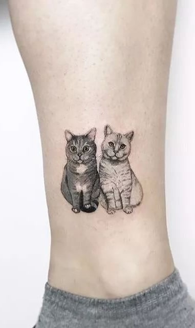 tatuaje gato en mujer 33