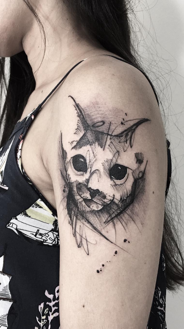 tatuaje gato en mujer 59